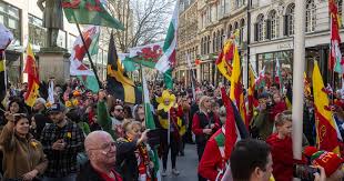 A puréed and simmering carrot soup in a pot with a spoon
